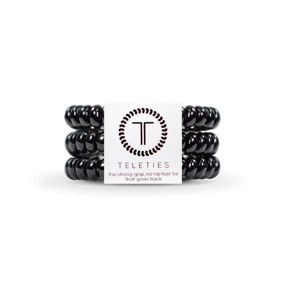 Teleties jet black three‑pack front view showing compact packaging and convenience