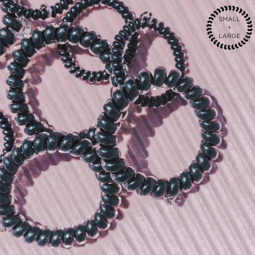 Teleties jet black under water droplets showing water‑resistant quick‑dry benefit