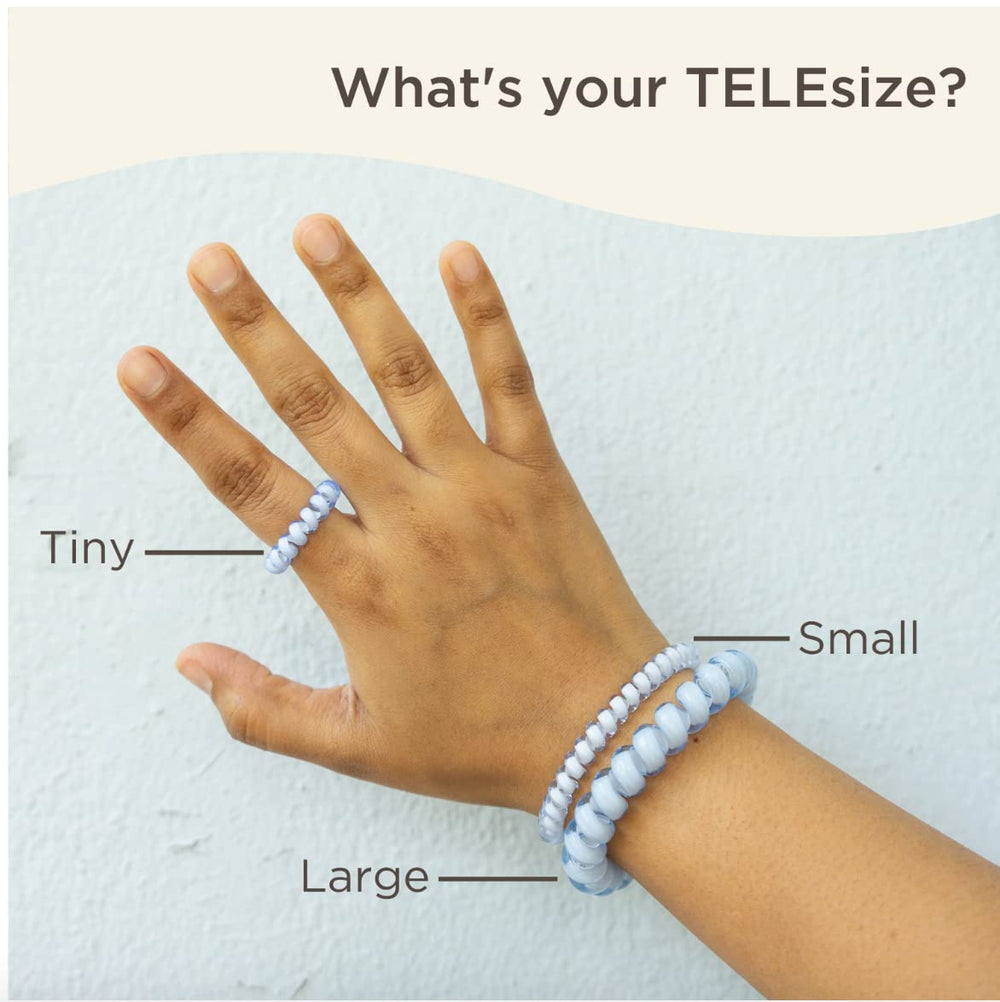 TELETIES next to a hand illustrating large size capacity for thick hair benefit