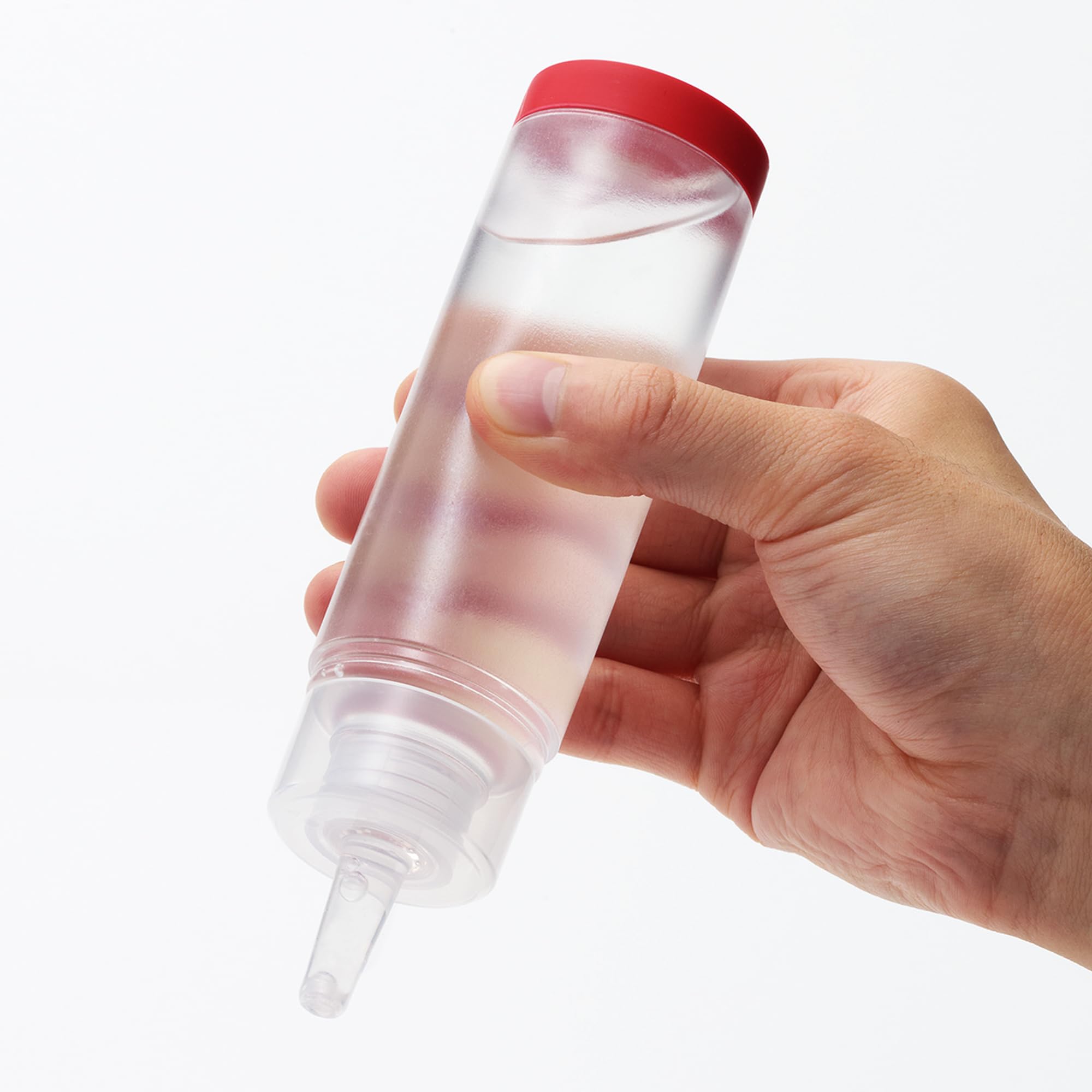 TENGA red lotion pouring to show smooth texture and silky glide benefits