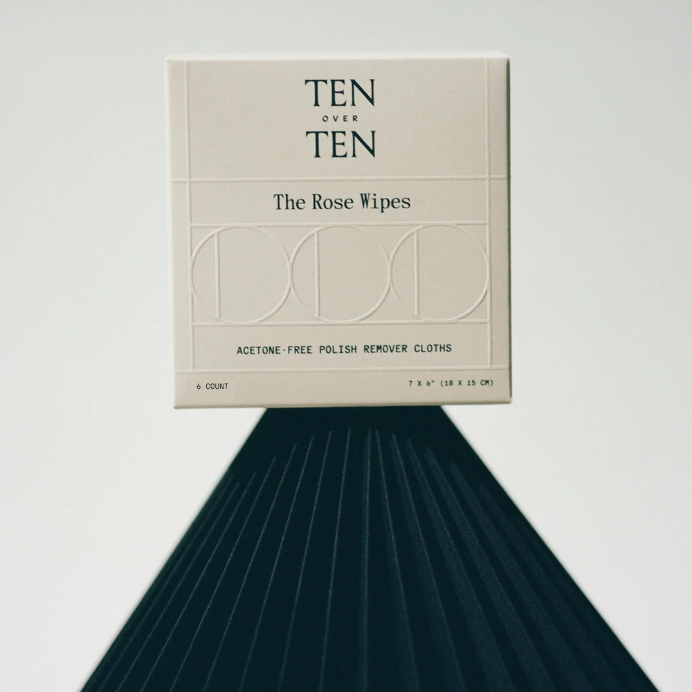 Tenoverten wipe in hand removing polish, demonstrating portable no-fume convenience