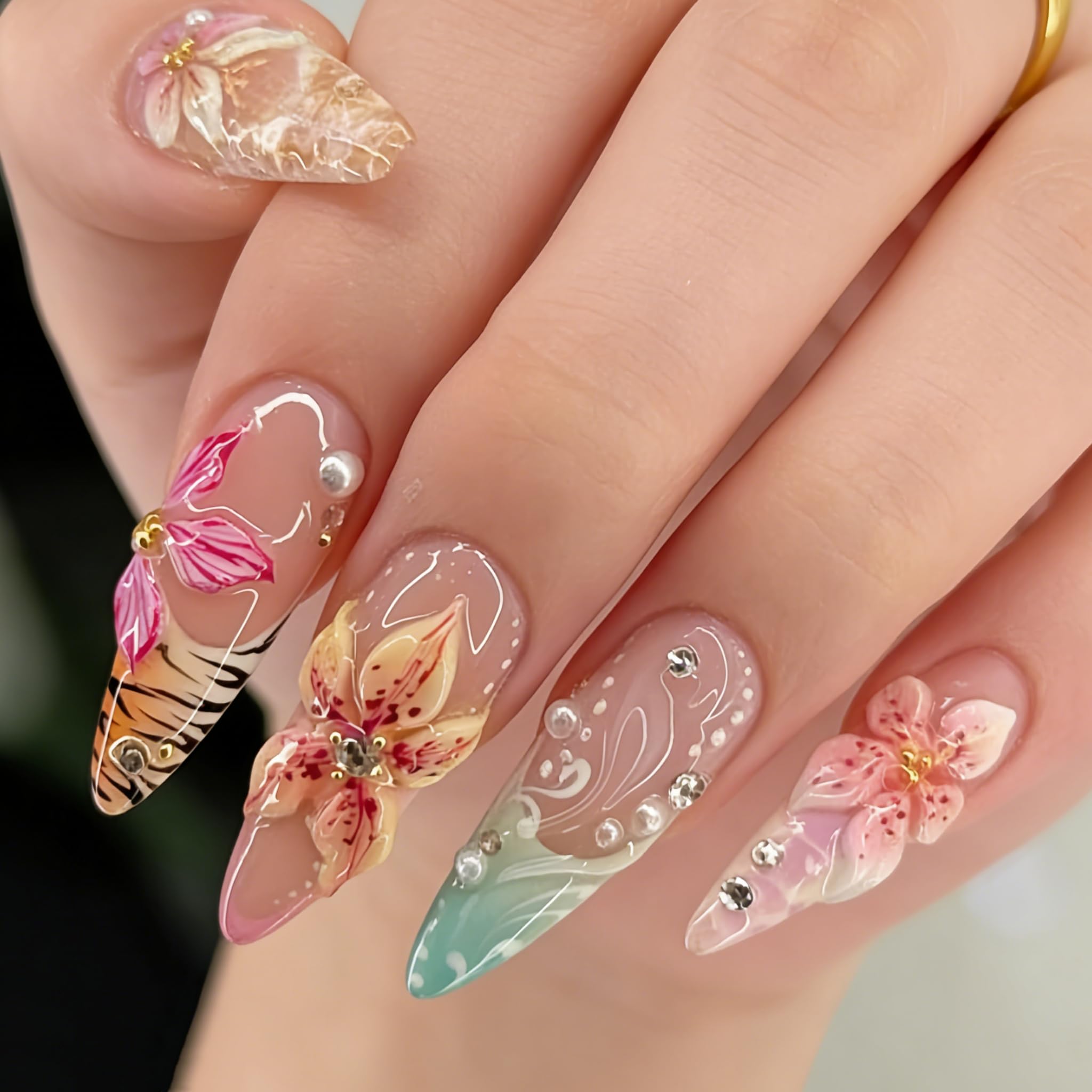 Tephrent almond-shaped nails top view showing glossy finish and detailed flower design