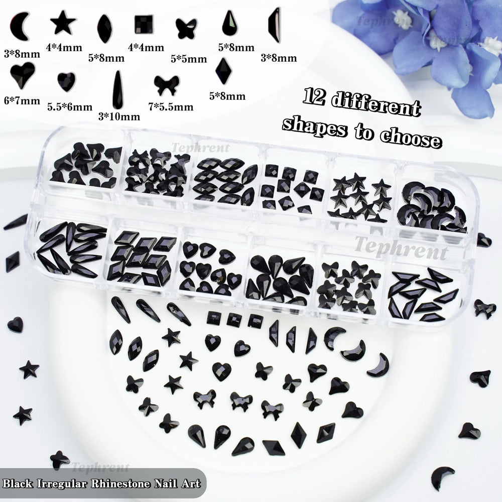 Tephrent charms applied to an acrylic nail sample showcasing gothic details and dramatic manicure impact