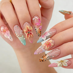 Tephrent close-up of gold and silver rhinestones on nail, adding refined sparkle