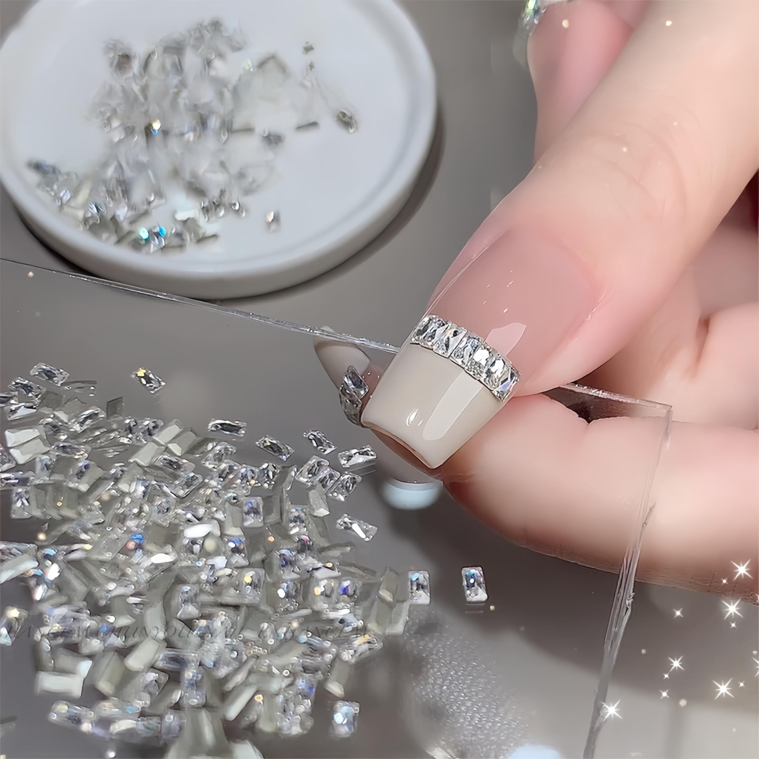 Tephrent clustered rectangular gems on French tip showcasing refined accent