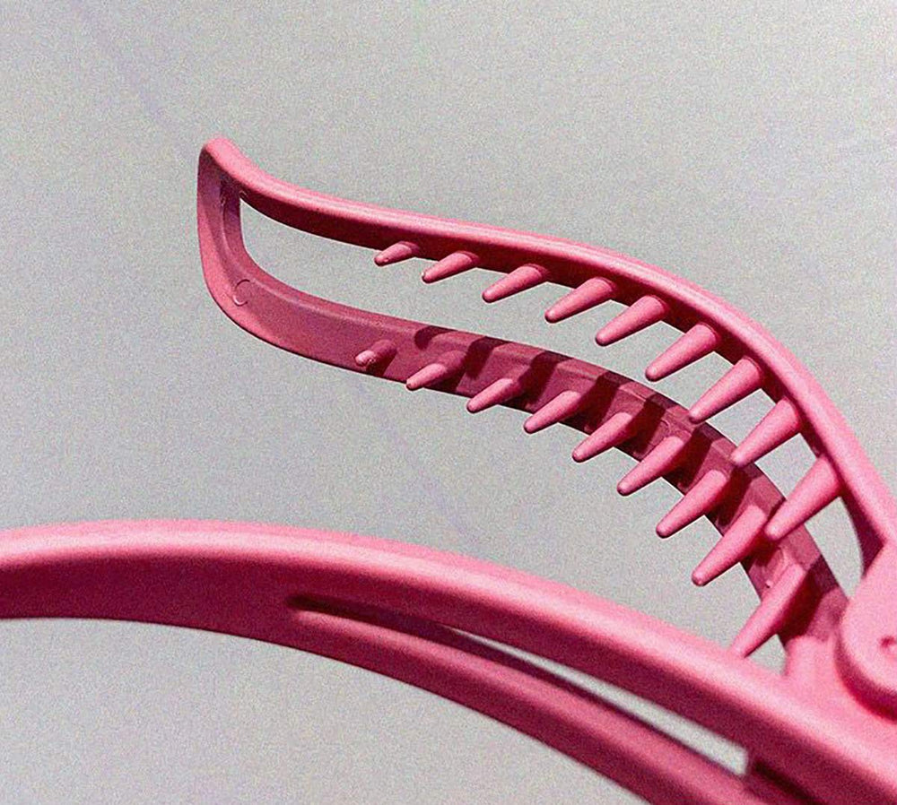 Tergy clip holding hair back at bathroom mirror for quick routines
