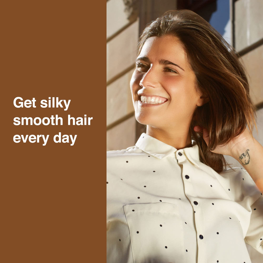 TERRAFIQUE serum being applied to damp hair for smoother blow-dry results