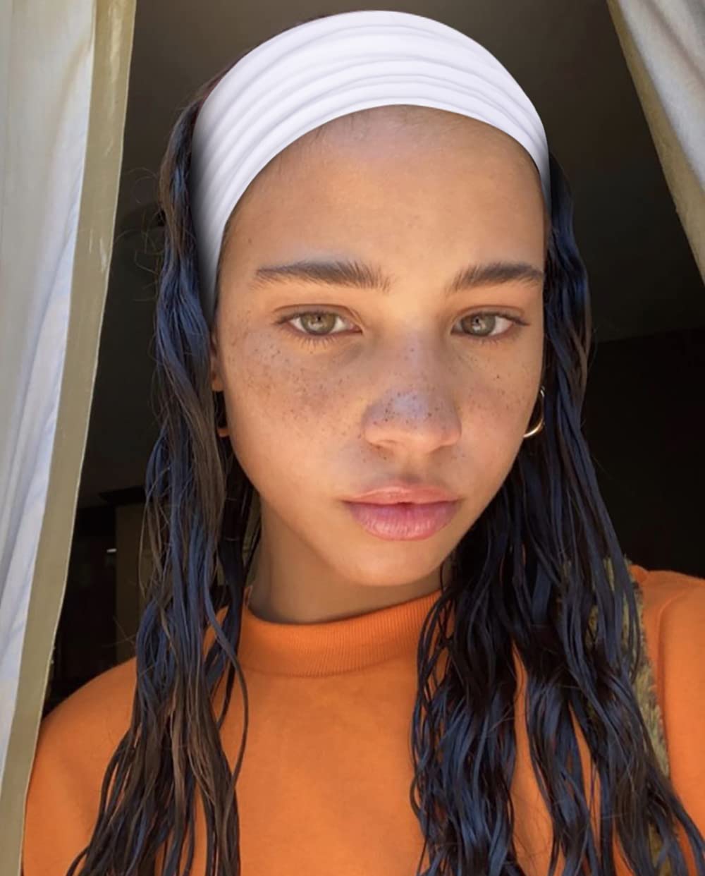 TERSE model wearing headband during yoga for sweat control and hair management