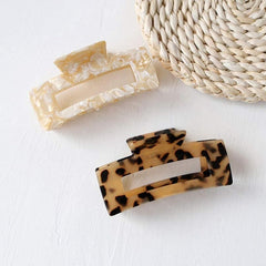 Textention clip inside a handbag showing portable accessory benefit for on-the-go use