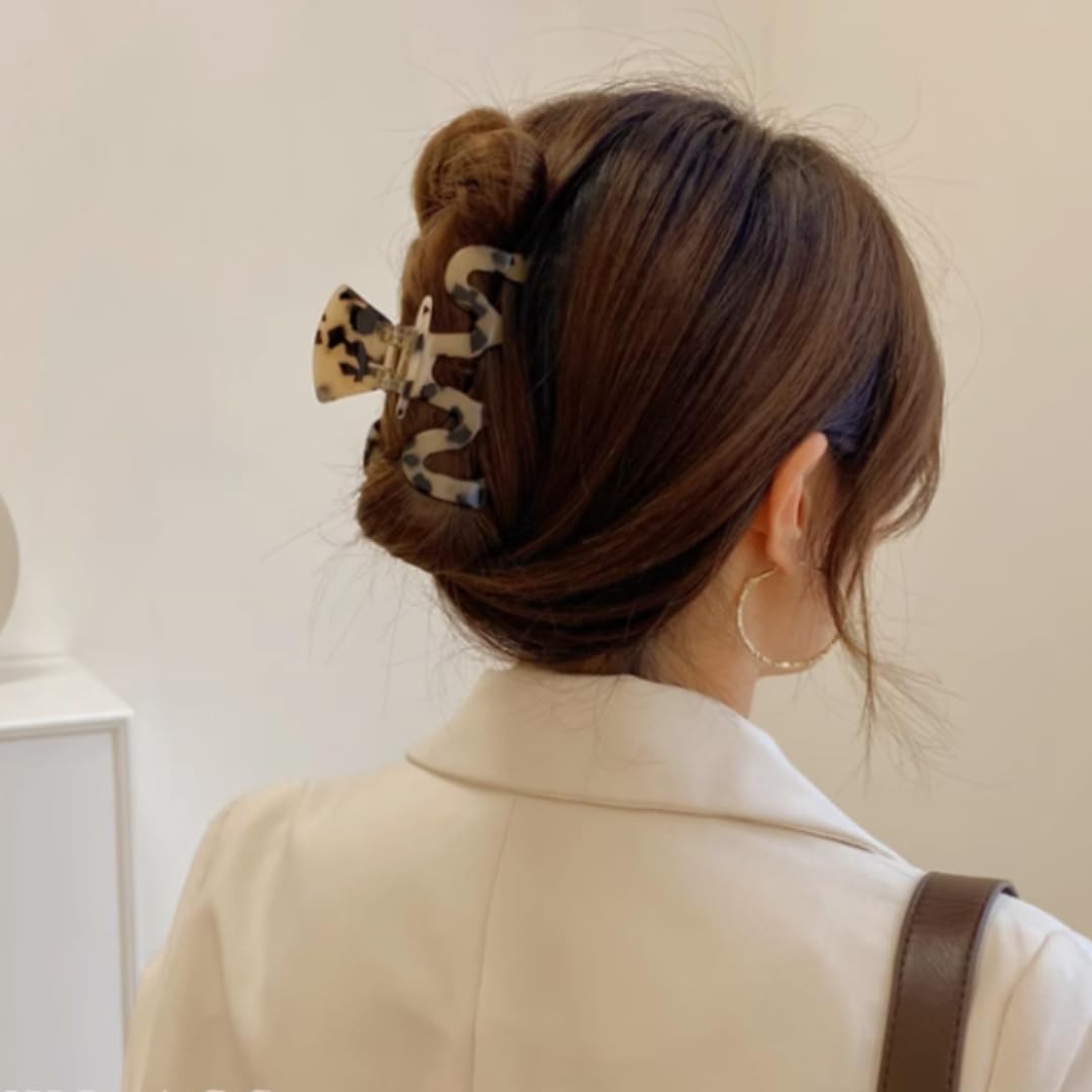 Textention packaging with two clips and hair tie showing what the set includes