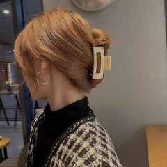 Textention clip beside credit card showing 3-inch size and travel-friendly compactness