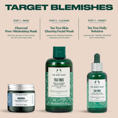The Body Shop charcoal mask beside green tea leaves showing calming botanical benefit