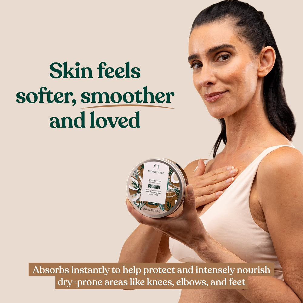Hand holding The Body Shop coconut body butter jar to show compact 1.69 oz scale