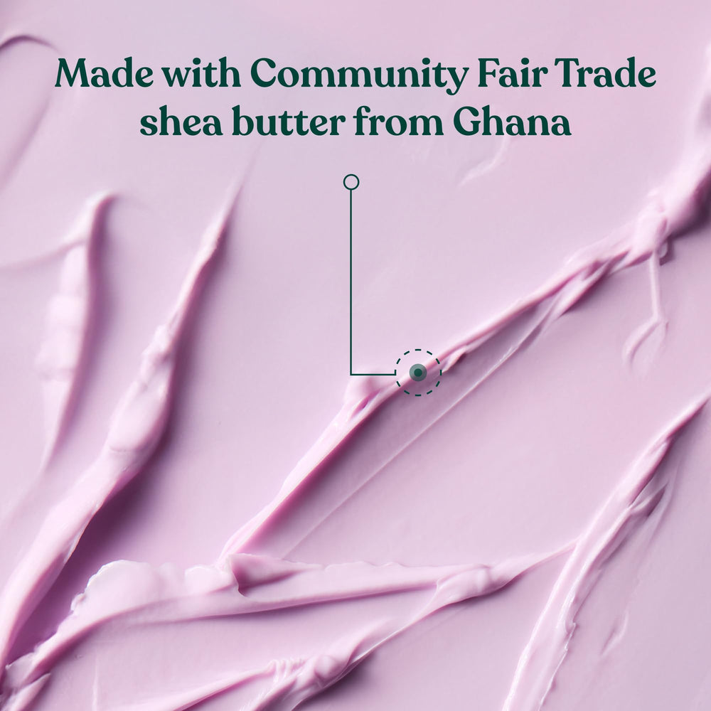 The Body Shop dewberry body butter being massaged into hand for soft skin benefit