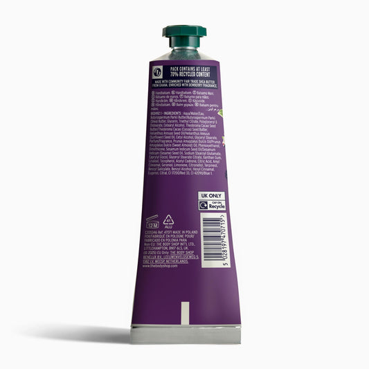 The Body Shop Dewberry hand balm texture visible at the open cap indicating fast-absorbing, non-greasy feel