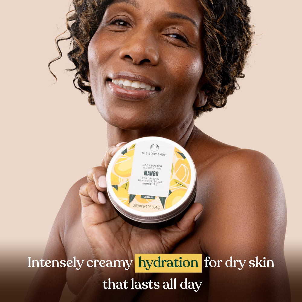 The Body Shop mango body butter being spread on arm demonstrating quick absorption and long-lasting moisture