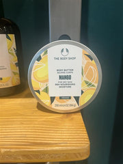 The Body Shop mango body butter recycled plastic tub and aluminium lid to show eco packaging