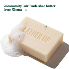 The Body Shop satsuma cleansing bar in shower being used for full-body refreshment benefit