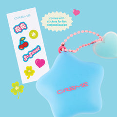 The Crème Shop charm clipped to a bag demonstrating easy attachment and everyday use