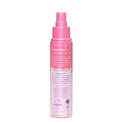 The Crème Shop Hello Kitty bottle held in hand to show size and travel-friendly benefit