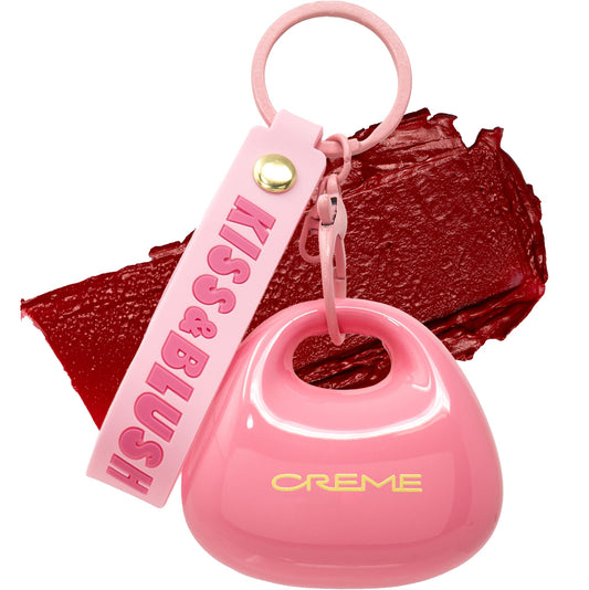 The Crème Shop front packaging showing cherry tint and charm benefit