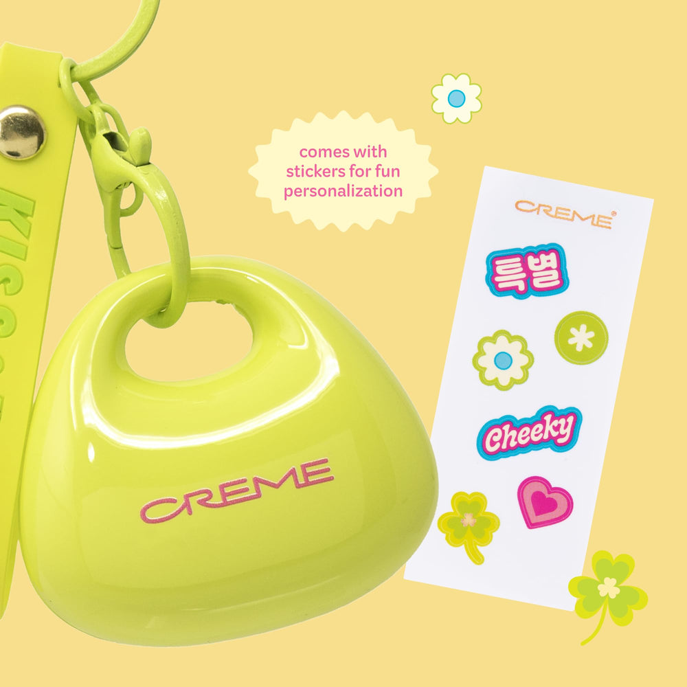 Size comparison of The Crème Shop tint in hand showing compact travel-ready benefit