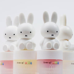 The Crème Shop open tube revealing balm surface and easy application