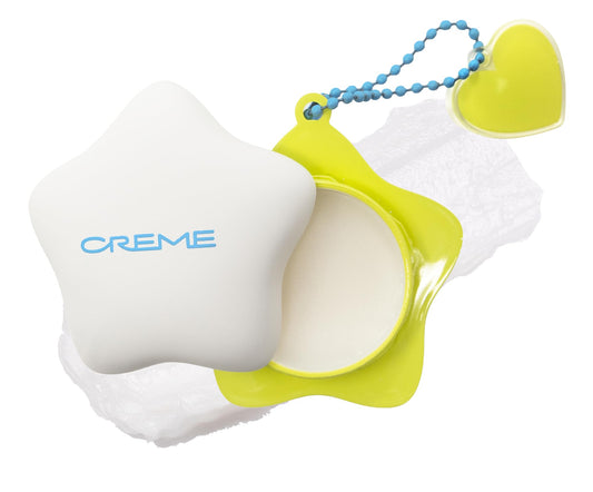 The Crème Shop front packaging showing compact keychain and product benefit