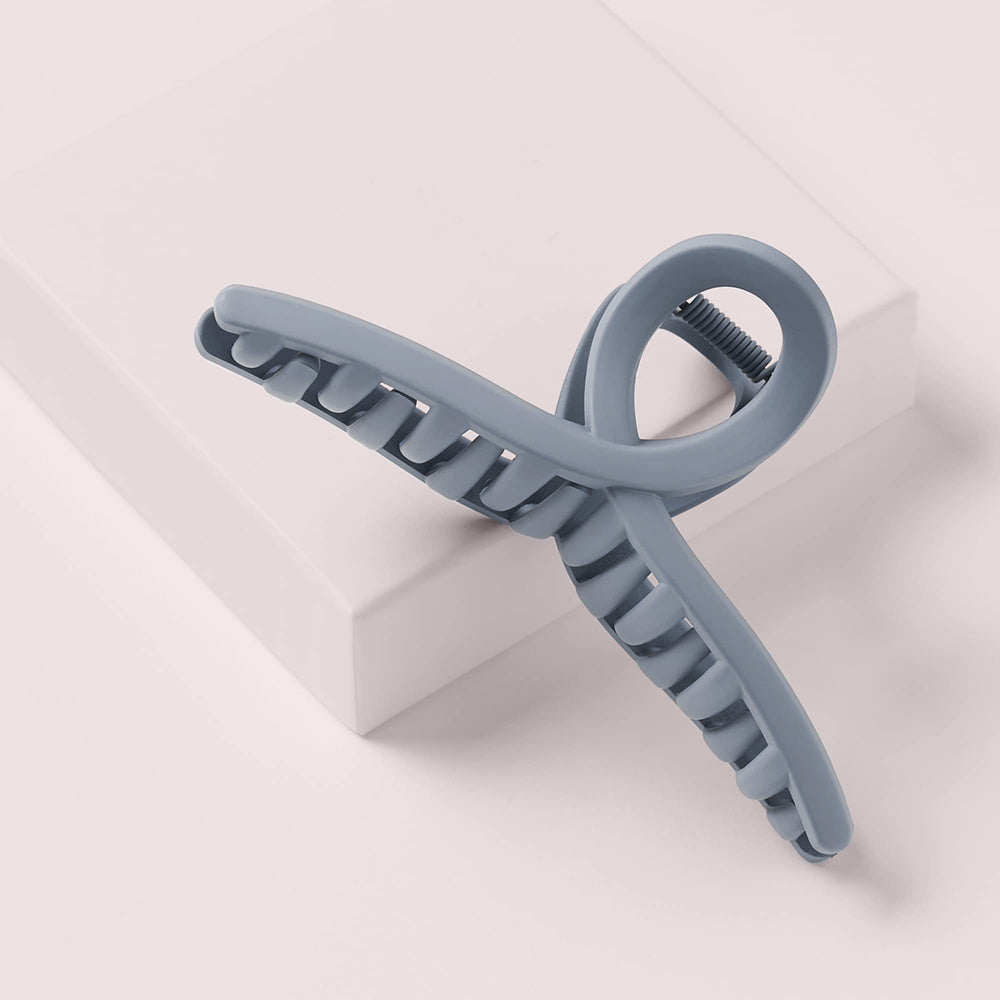 The Hair Edit clip in hair demonstrating French twist hold for polished updo benefit