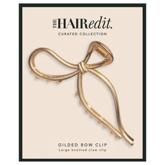 The Hair Edit clip styled with outfit showing festive chic enhancement benefit