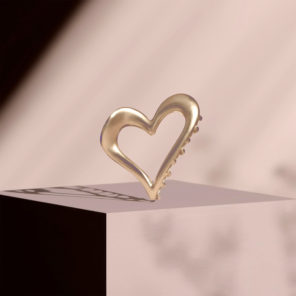 The Hair Edit heart clip in hair half-up demonstrating secure styling and flattering lift benefit: tidy finish