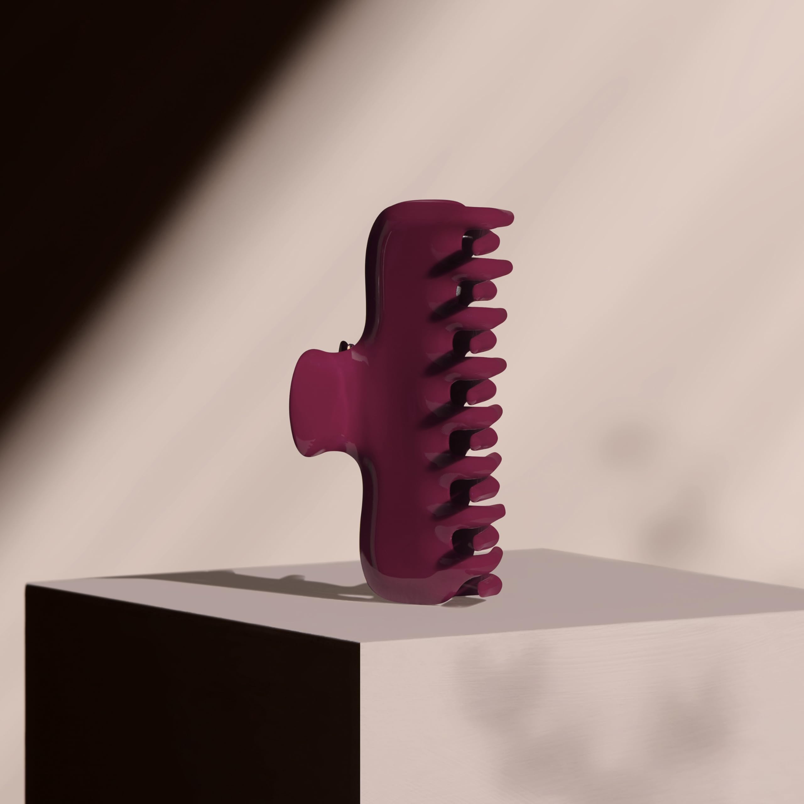 The Hair Edit scarlet claw clip securing an updo in a lifestyle setting for all-day wear