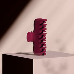 The Hair Edit scarlet claw clip securing an updo in a lifestyle setting for all-day wear