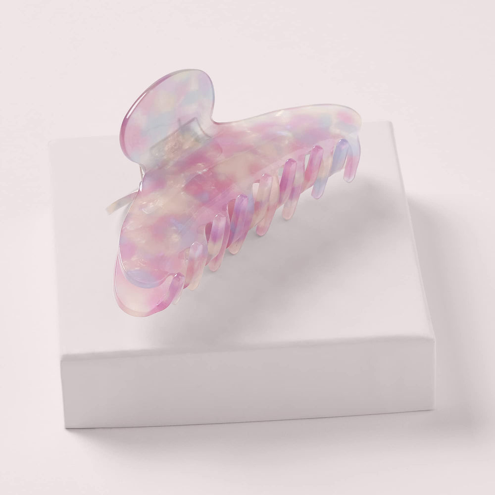 The Hair Edit Unicorn Clip worn in an updo demonstrating secure comfortable styling