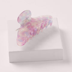 The Hair Edit Unicorn Clip worn in an updo demonstrating secure comfortable styling