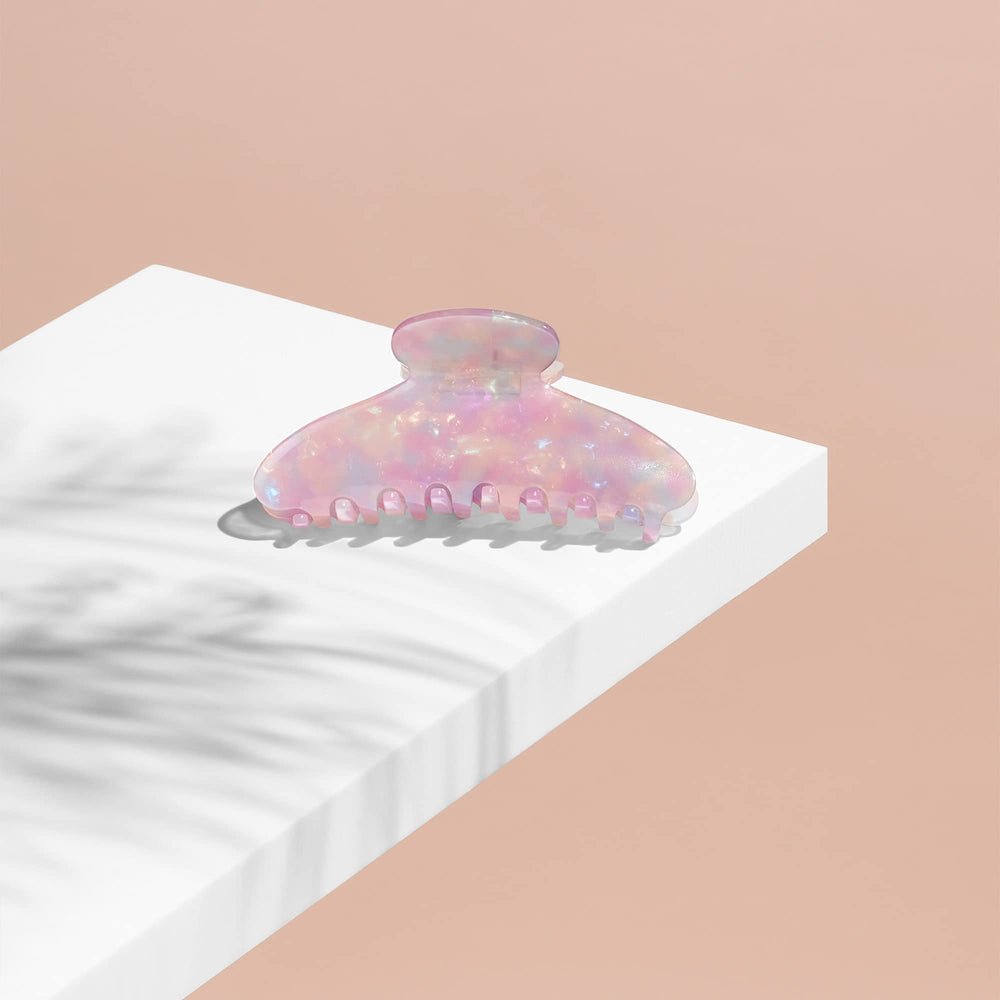 The Hair Edit Unicorn Clip next to a ruler showing large size and practical scale