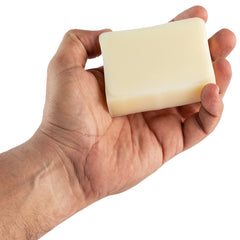 The Healthy Porcupine bar next to a coin showing 4 oz size for travel convenience