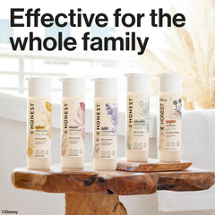 The Honest Company 10 fl oz bottle shown next to ruler to show accurate size
