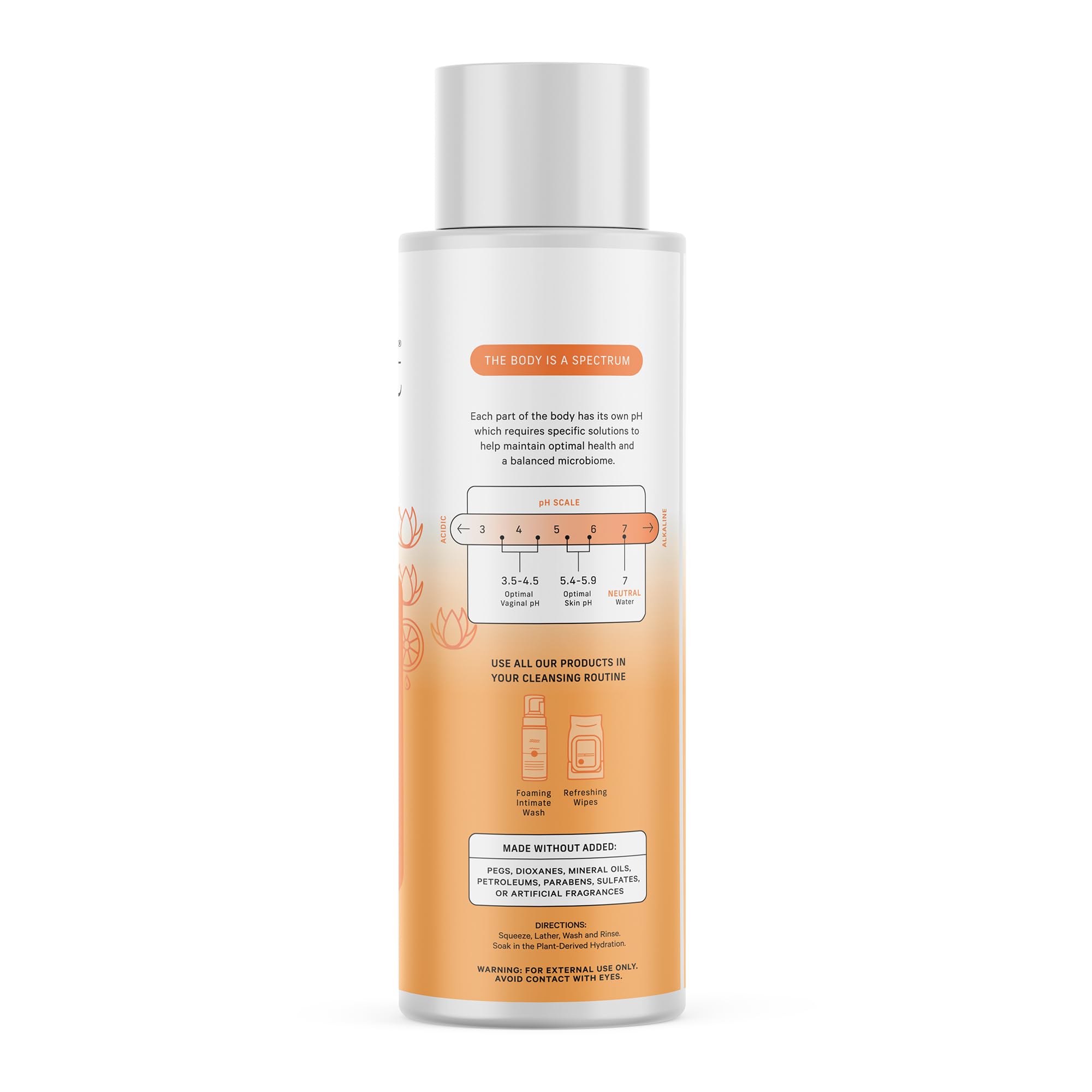 The Honey Pot Company bottle photographed with grapefruit and ylang ylang flower