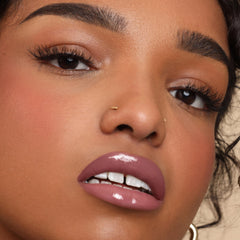 The Lip Bar swatch on lips close-up, demonstrates sheer tint and hydrating sheen