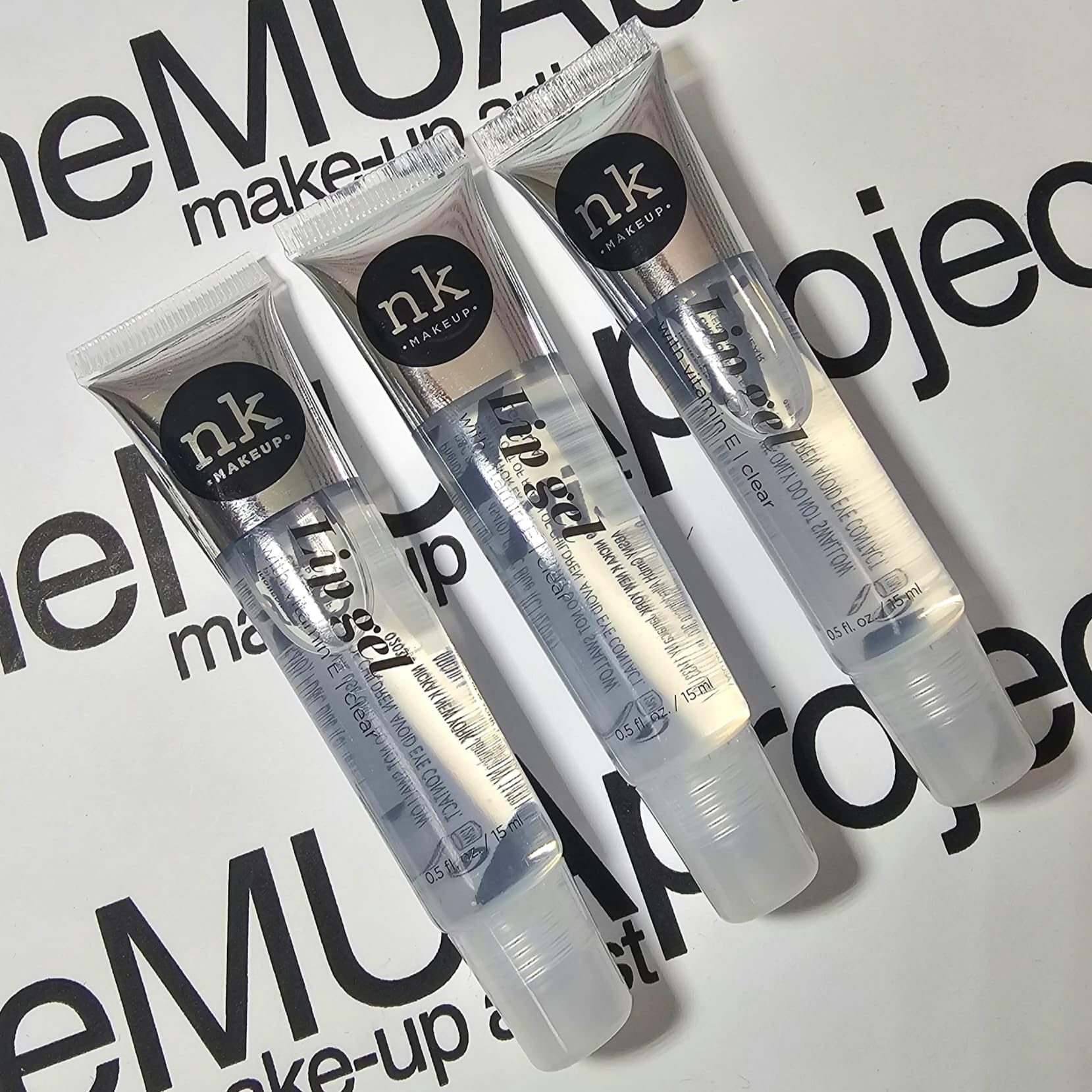 The Make-Up Artist Project gloss in use over lipstick highlighting enhanced shine