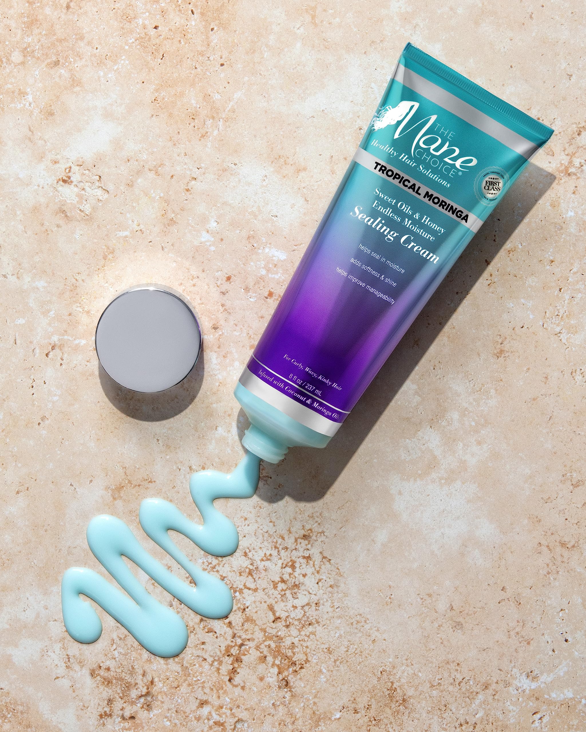 The Mane Choice 8 ounce jar beside a hand for scale, indicating travel-friendly size
