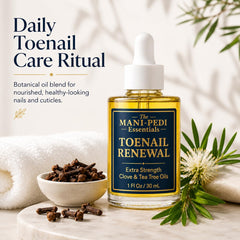 The Mani Pedi Essentials serum dropper dispensing a clear drop, demonstrating controlled application