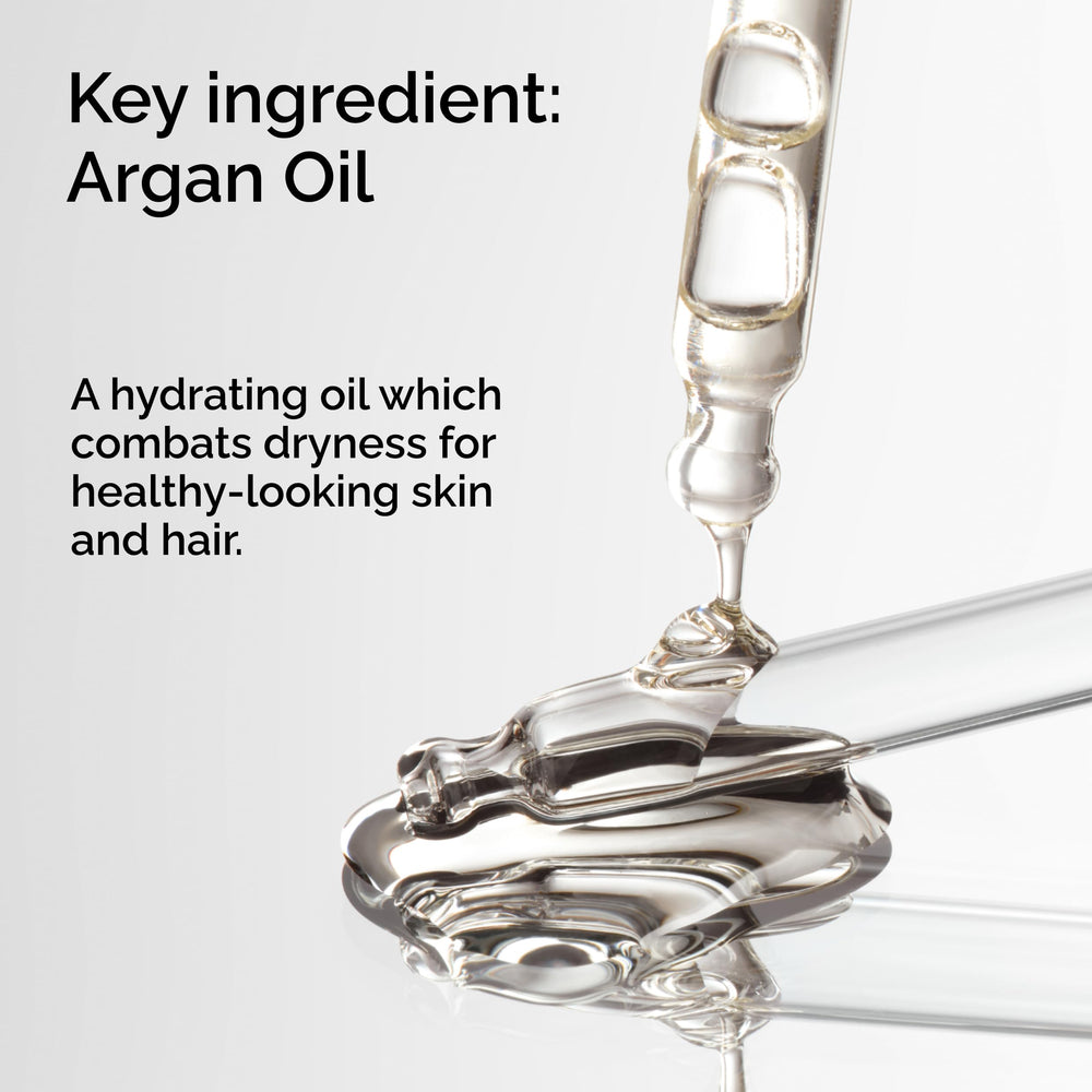 The Ordinary argan oil dropper dispensing a golden drop for precise use