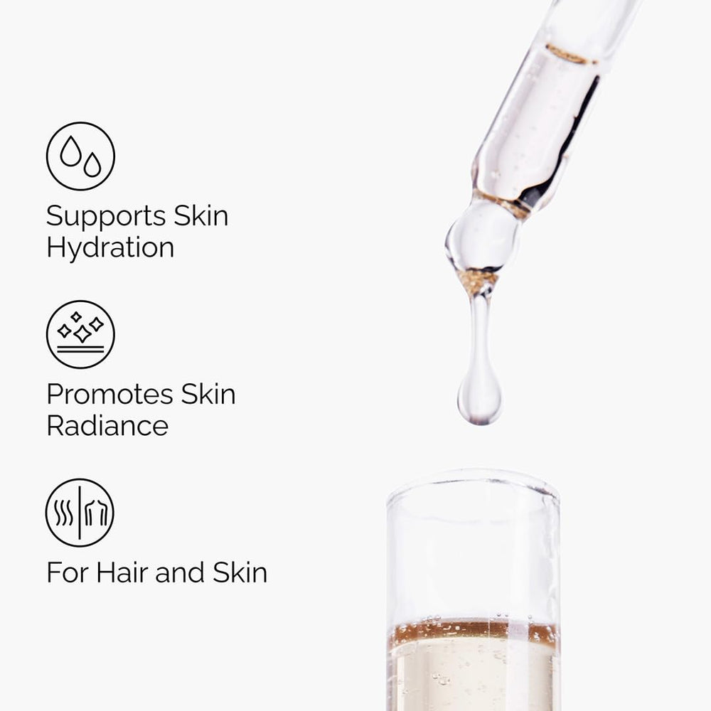 Dropper dispensing a golden drop from The Ordinary bottle to demonstrate controlled dosing