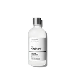 The Ordinary essence on a bathroom shelf in lifestyle scene conveying daily use