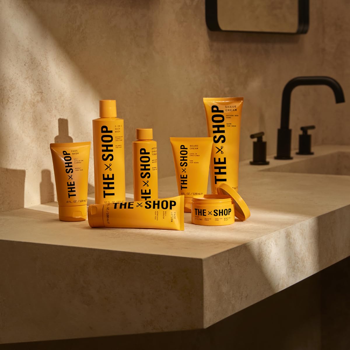 The Shop Uninterrupted bottle next to a razor showing 4 fl oz travel-friendly size