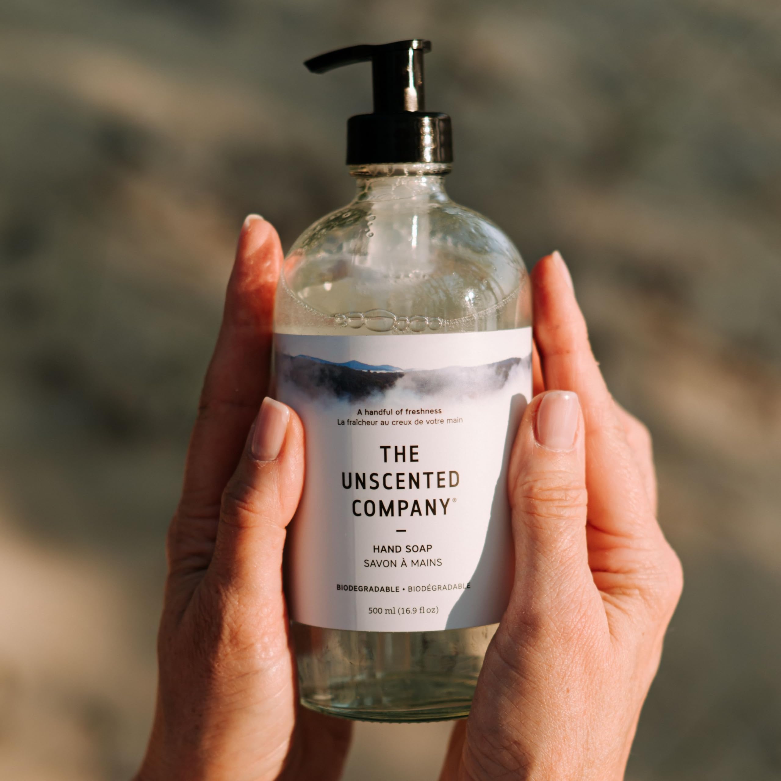 The Unscented Company bottle on a bathroom sink in a lifestyle scene benefit: blends with modern home decor