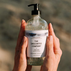 The Unscented Company bottle on a bathroom sink in a lifestyle scene benefit: blends with modern home decor