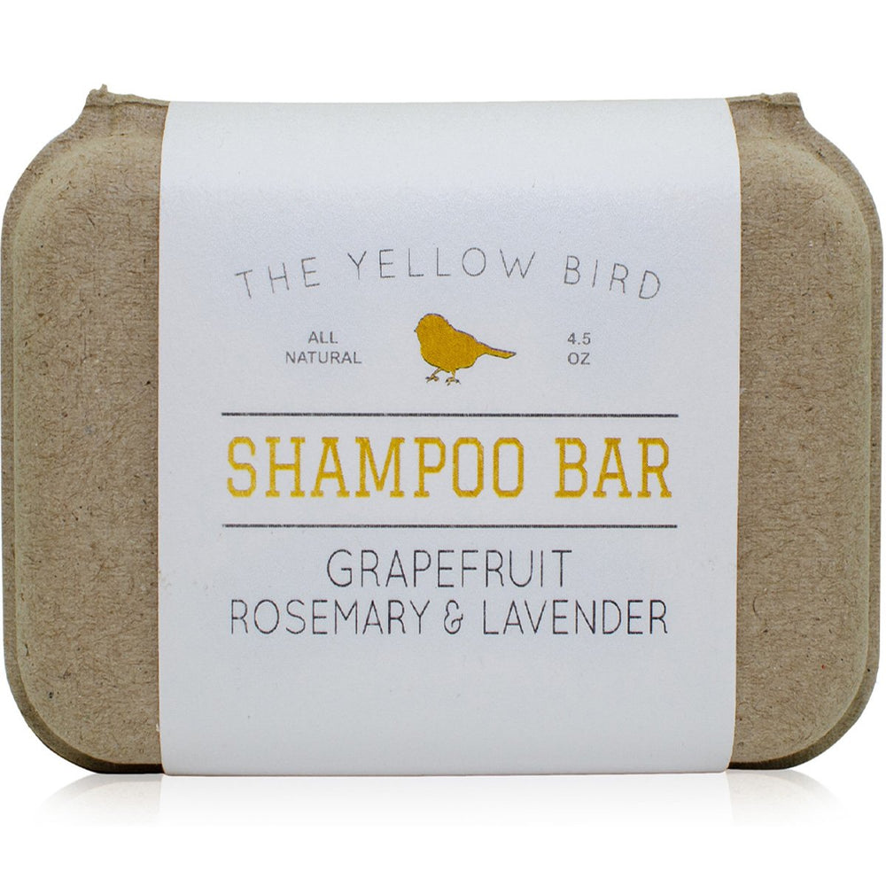 The Yellow Bird front packaging showing shampoo bar and scent label, clear product identity